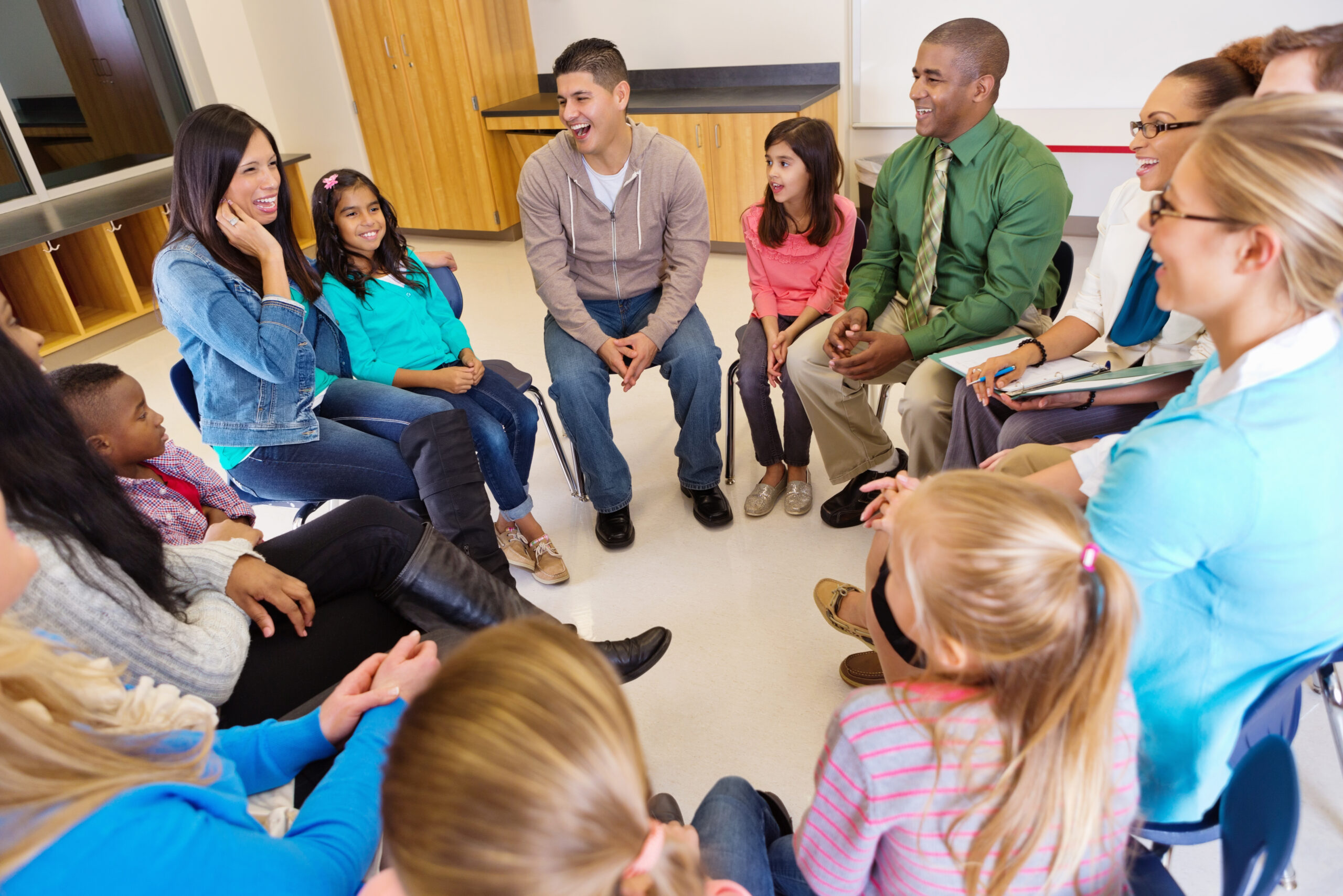 Conference or meeting with elementary school teachers students and parents